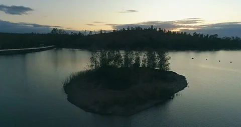 Aerial sunset view of Mina de São Domingos, Beach lagoon, Portugal. (C) Stock Footage 116444926