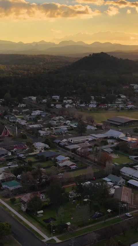 Aerial Sunset View Over Coonabarabran Township and Warrumbungle Mountains Stock Footage 340319741
