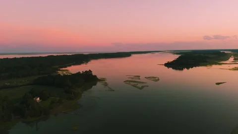 Aerial sunset view over Eastern Shore marshlands, tidal wetlands, and waterways  Stock Footage 344059402