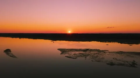 Aerial sunset view over Eastern Shore marshlands, tidal wetlands, and waterways  Stock Footage 344059403