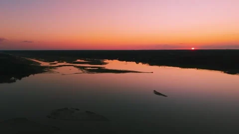 Aerial sunset view over Eastern Shore marshlands, tidal wetlands, and waterways  Stock Footage 344059413