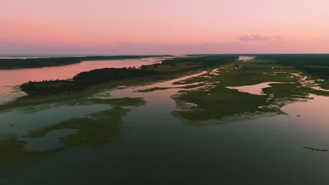 Aerial sunset view over Eastern Shore marshlands, tidal wetlands, and waterways  Stock Footage 344059414