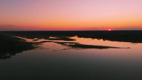 Aerial sunset view over Eastern Shore marshlands, tidal wetlands, and waterways  Stock Footage 344059463