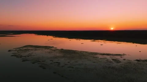Aerial sunset view over Eastern Shore marshlands, tidal wetlands, and waterways  Stock Footage 344059465