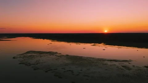 Aerial sunset view over Eastern Shore marshlands, tidal wetlands, and waterways  Stock Footage 344059486
