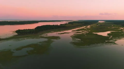 Aerial sunset view over Eastern Shore marshlands, tidal wetlands, and waterways  Stock Footage 344059515