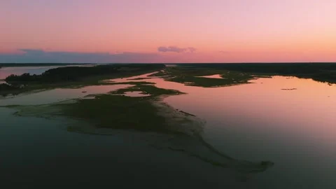 Aerial sunset view over Eastern Shore marshlands, tidal wetlands, and waterways  Stock Footage 344059549