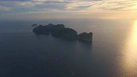 Aerial sunset view of Phi Phi Island and Maya Bay in Thailand, with dark Stock Footage 342290768