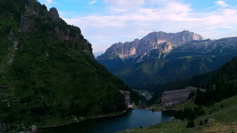 Aerial sunset view towards Mount Presolana from the Gleno Disaster Dam ruins in Stock Footage 342576132