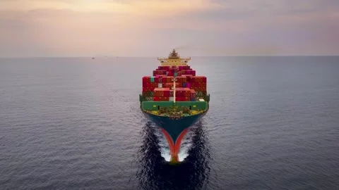Aerial sunset view tracking of a big cargo container carrier ship Video stock 294976457