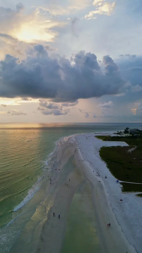 Aerial Sunset View of White Sand Beach in Siesta Key, Florida, with Dramatic Stock Footage 332217101