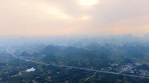 Aerial Sunset View of Yangmeiling Karst Mountains in Yangshuo, Guilin, China Stock Footage 326120397