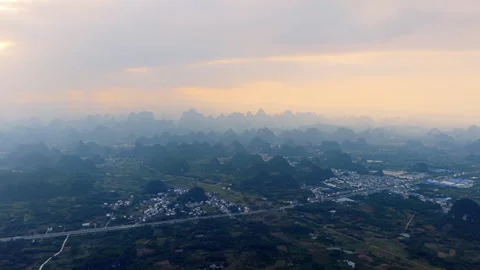 Aerial Sunset View of Yangmeiling Karst Mountains in Yangshuo, Guilin, China Stock Footage 326120414