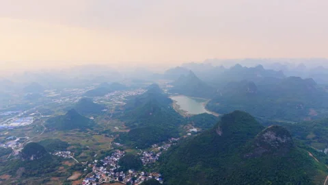 Aerial Sunset View of Yangmeiling Karst Mountains in Yangshuo, Guilin, China Stock Footage 326120434