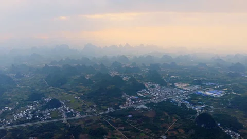 Aerial Sunset View of Yangmeiling Karst Mountains in Yangshuo, Guilin, China Stock Footage 326120459