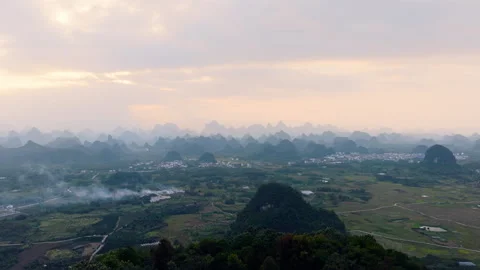 Aerial Sunset View of Yangmeiling Karst Mountains in Yangshuo, Guilin, China Stock Footage 326393202