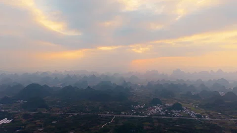 Aerial Sunset View of Yangmeiling Karst Mountains in Yangshuo, Guilin, China Stock Footage 326394953