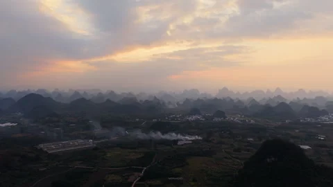 Aerial Sunset View of Yangmeiling Karst Mountains in Yangshuo, Guilin, China Stock Footage 326707898