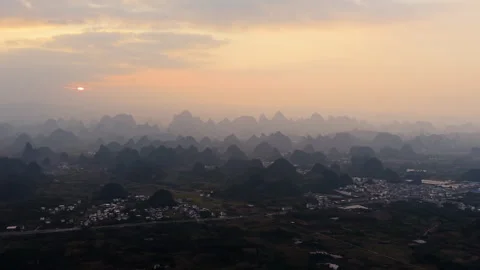 Aerial Sunset View of Yangmeiling Karst Mountains in Yangshuo, Guilin, China Stock Footage 326707902
