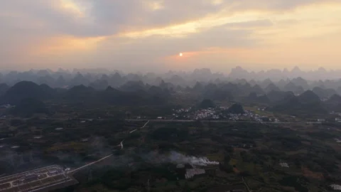 Aerial Sunset View of Yangmeiling Karst Mountains in Yangshuo, Guilin, China Stock Footage 326707923