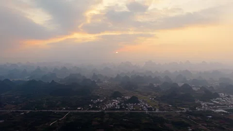 Aerial Sunset View of Yangmeiling Karst Mountains in Yangshuo, Guilin, China Stock Footage 326707934