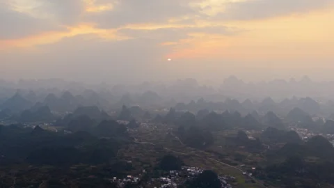Aerial Sunset View of Yangmeiling Karst Mountains in Yangshuo, Guilin, China Stock Footage 326707954
