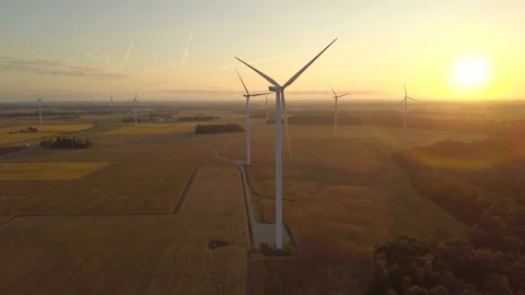 Aerial sunset with windmills in a front Stock Footage 114583476
