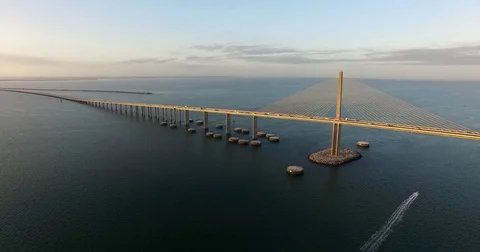 Aerial Sunshine Skyway at Sunrise with Boat underneath Stock Footage