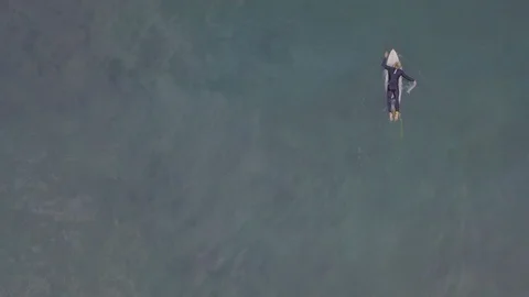 Aerial: Surfer paddling Stock Footage 92685404