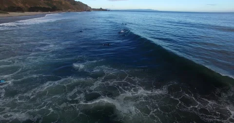 Aerial of Surfers Catching Waves Stock Footage 64286592
