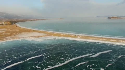 Aerial survey from the air. Winter. Lake Baikal. Small sea Stock Footage 67597341