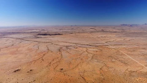 Aerial survey of Spitzkoppe desert plain, Namibia, with inselbergs Stock Footage 341422604