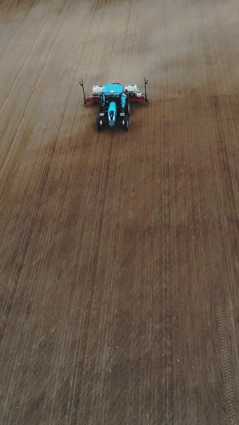 Aerial survey, top view, spring, a tractor with special precision planters is Stock Footage 309635225