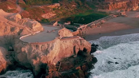 Aerial: Sutro Baths and Point Lobos at sunset. San Francisco. California,  USA Stock Footage 162195377
