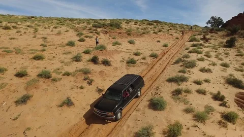 Aerial of SUV 4X4 Off-Roading Down Red Dune Stock Footage 101625272