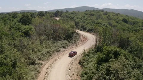 Aerial suv car tracking on off-road forest road Stock Footage 151342685