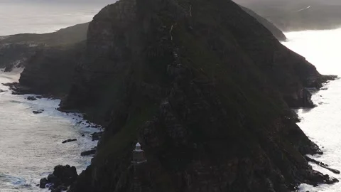 Aerial sweep of Cape Point cliffs and lighthouse near Cape Town Stock Footage 336287690
