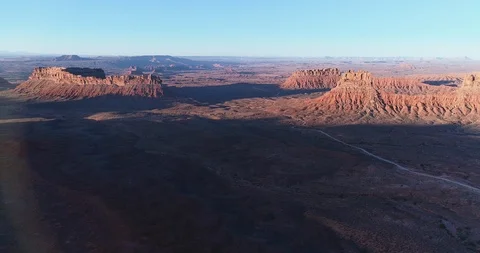Aerial sweeping view of shadows over Monument Valley Stock Footage 95607114