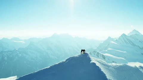 Aerial Swiss mountain Alps mountaineering snow climbers travel Stock Footage