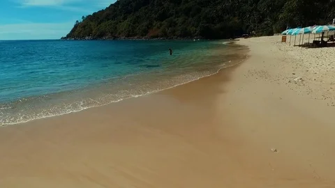 Aerial: Takeoff from the beach. Stock Footage 69844664