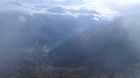 Aerial of terraced and patchwork fields on a foggy day Stock-Footage 79679017