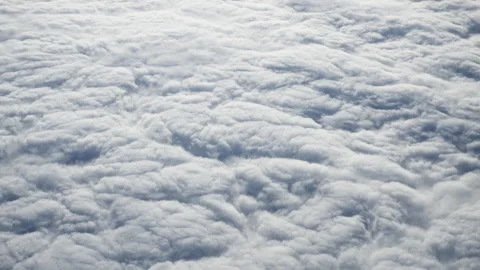 Aerial texture view of dense white fluffy cumulus clouds filling the frame Stock Footage 325113455