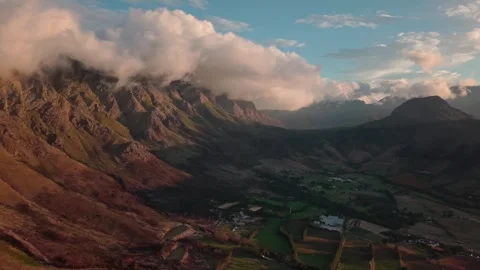 Aerial of a textured mountain face in cloud near Franschhoek Stock Footage 346701219