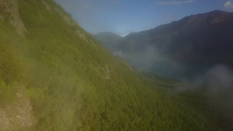 Aerial through clouds close to mountainside Stock Footage 115509447