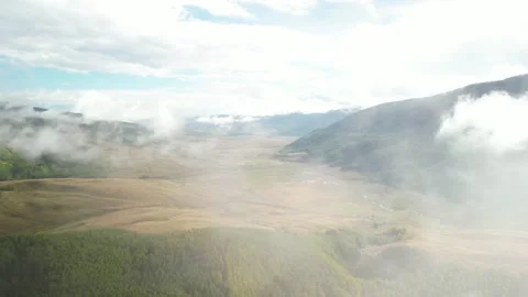 Aerial through low clouds above Brush Creek valley in Crested Butte in fall Stock Footage 251027018