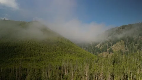 Aerial through low clouds near Stanley Idaho in Sawtooth mountains in summer Stock Footage 280219561