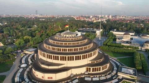 Aerial tilt down to Centennial Hall in Wrocław at golden hour Видео 346658771