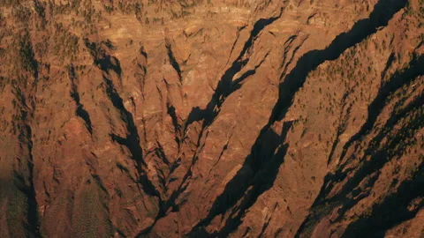 Aerial tilt down over the cliff of a high plateau Las Playas under sun Stock Footage 170599358