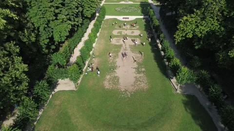 Aerial Tilt Down on People Playing in Cinquantenaire Park Brussels Stock Footage 338433685