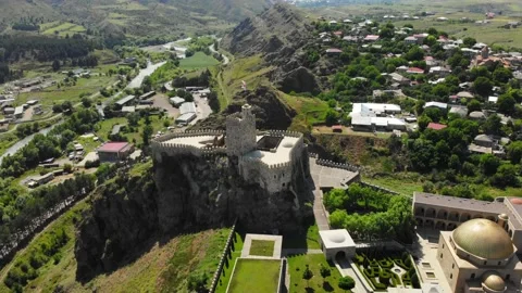 Aerial tilt down reveal view flag wave on Akhaltsikhe fortress on Rabati in G Stock-Footage 201250425